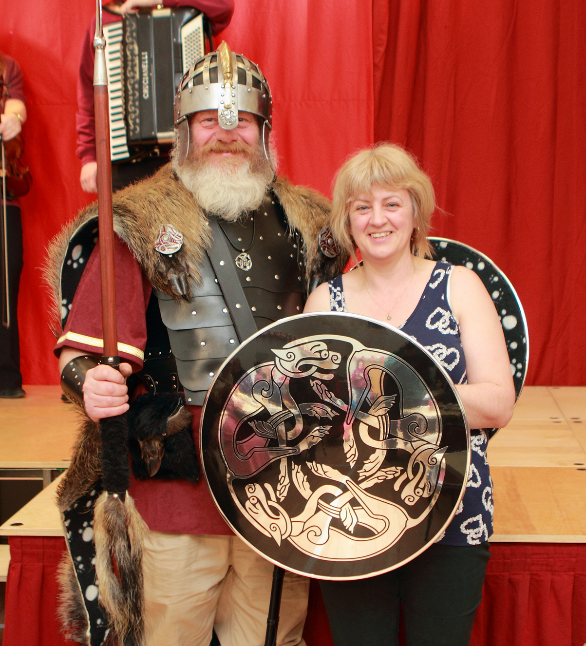 Wir Jarl presenting the shield to Alexis a Committee Member for the Hall